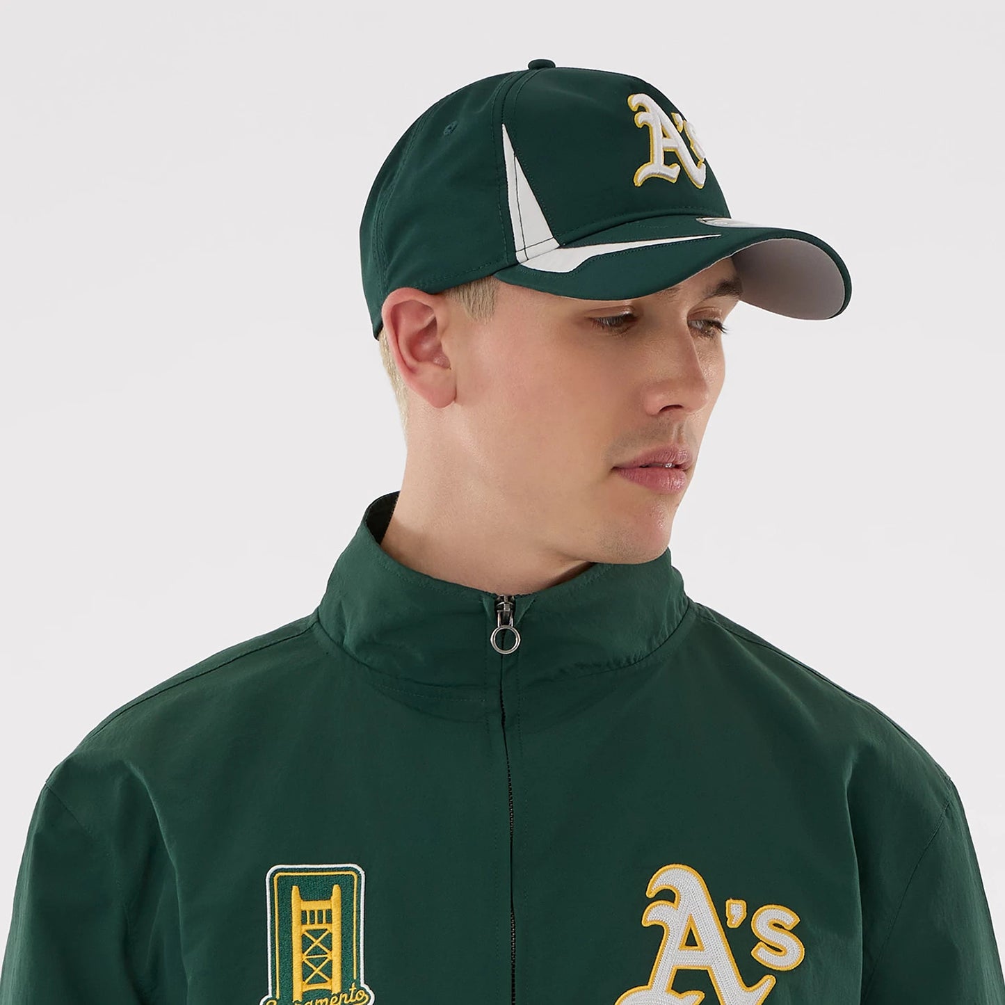 The model is wearing this MLB Athletics Sports Jacket in dark green. 7