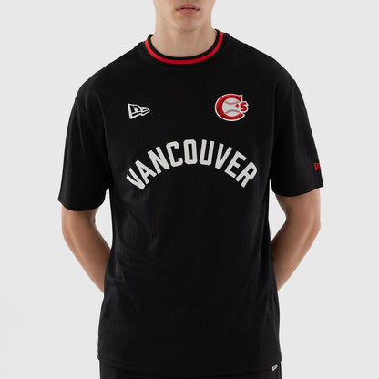 The model is wearing this MiLB Vancouver Canadians Oversized T-Shirt in black. 3