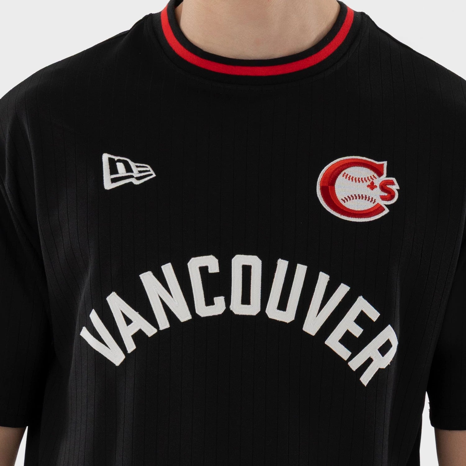The model is wearing this MiLB Vancouver Canadians Oversized T-Shirt in black. 4