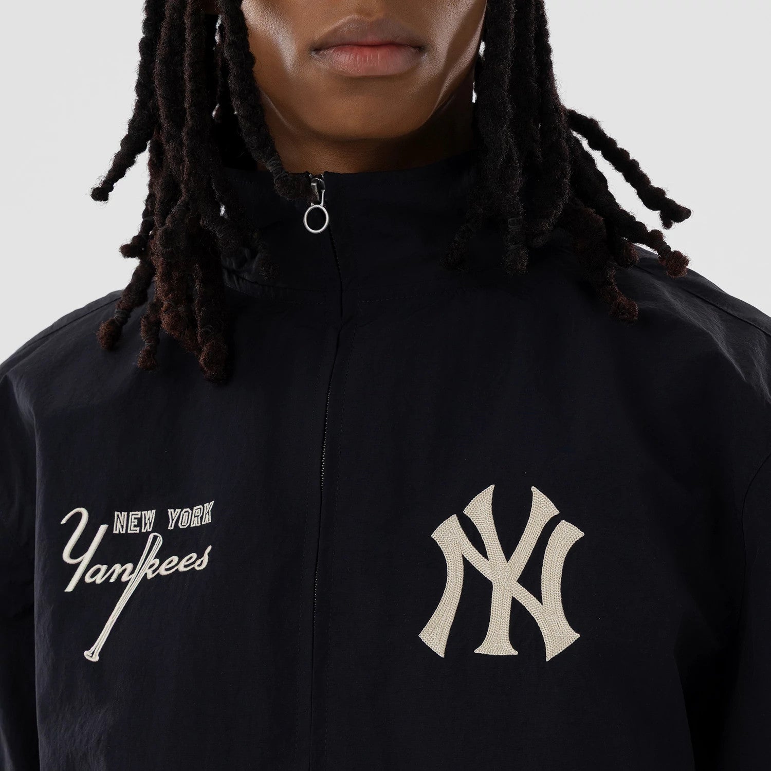 The model is wearing this MLB New York Yankees Sports Jacket in navy. 4