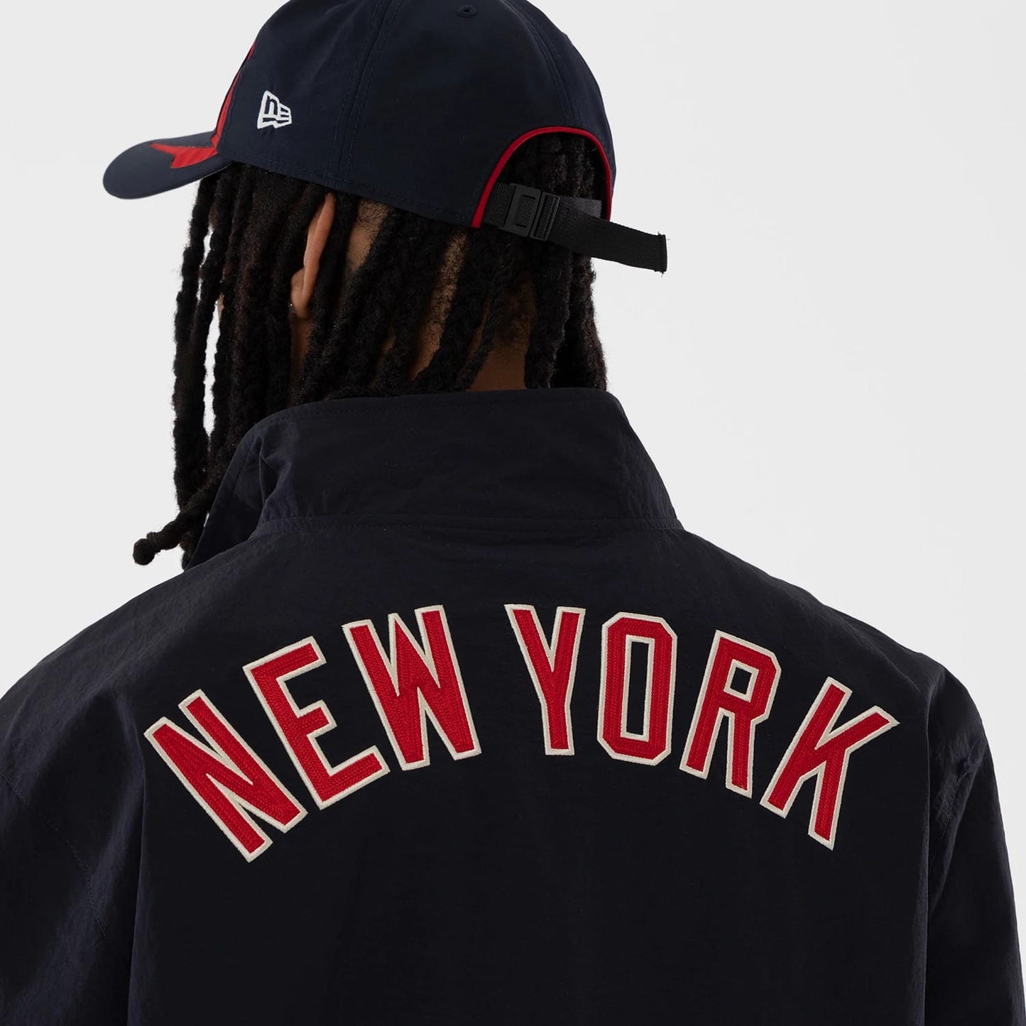 The model is wearing this MLB New York Yankees Sports Jacket in navy. 5
