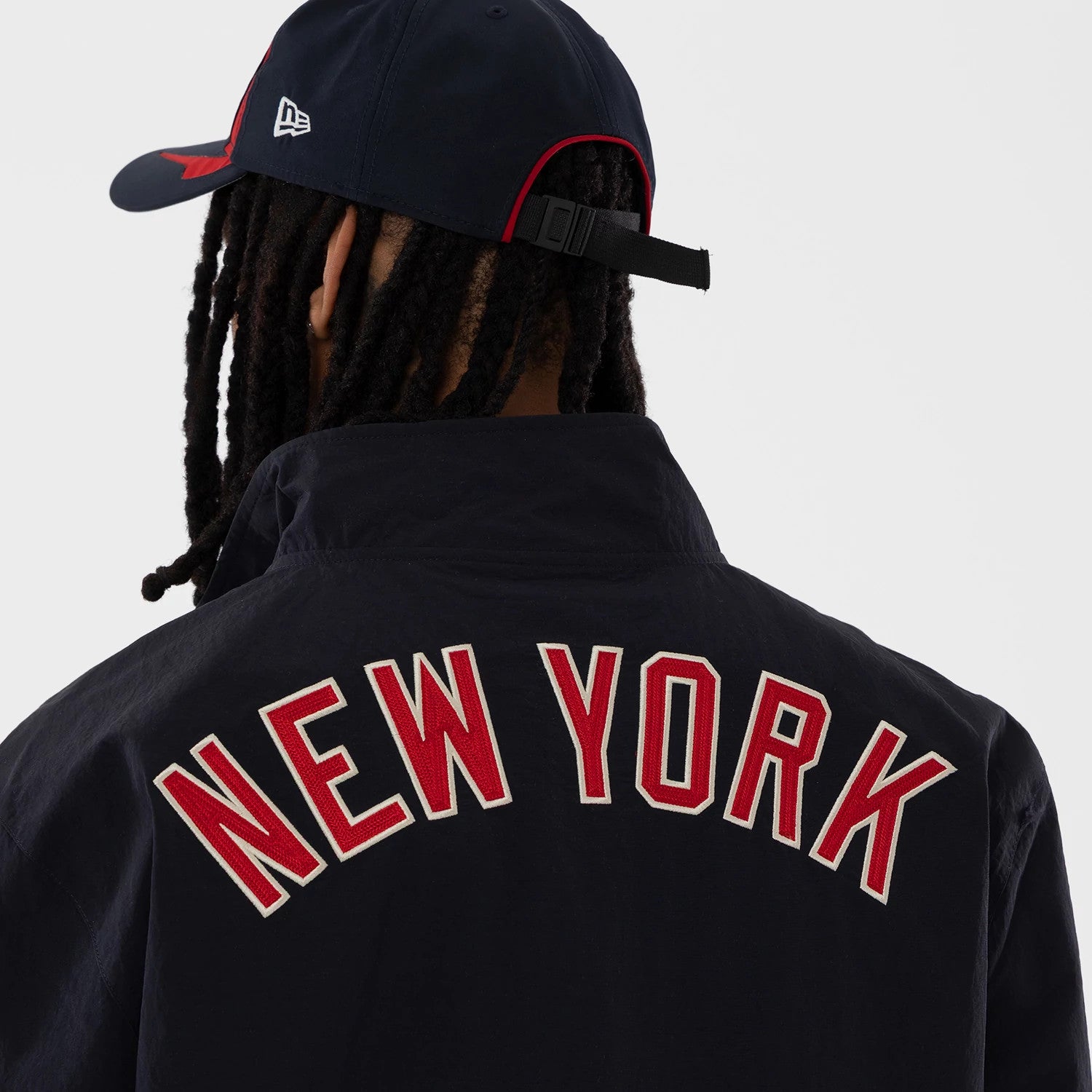 The model is wearing this MLB New York Yankees Sports Jacket in navy. 5