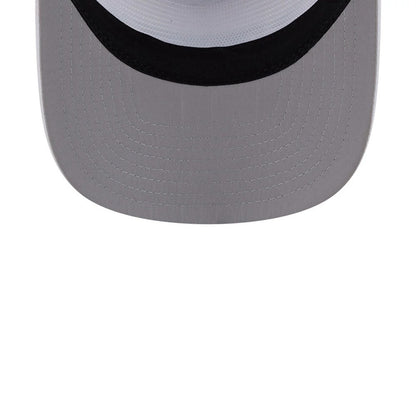 New Era Golf White 19TWENTY Adjustable Cap, top view showing the light grey visor with stitching, contrasting black edge beneath the white crown, and the classic curved shape of the visor.