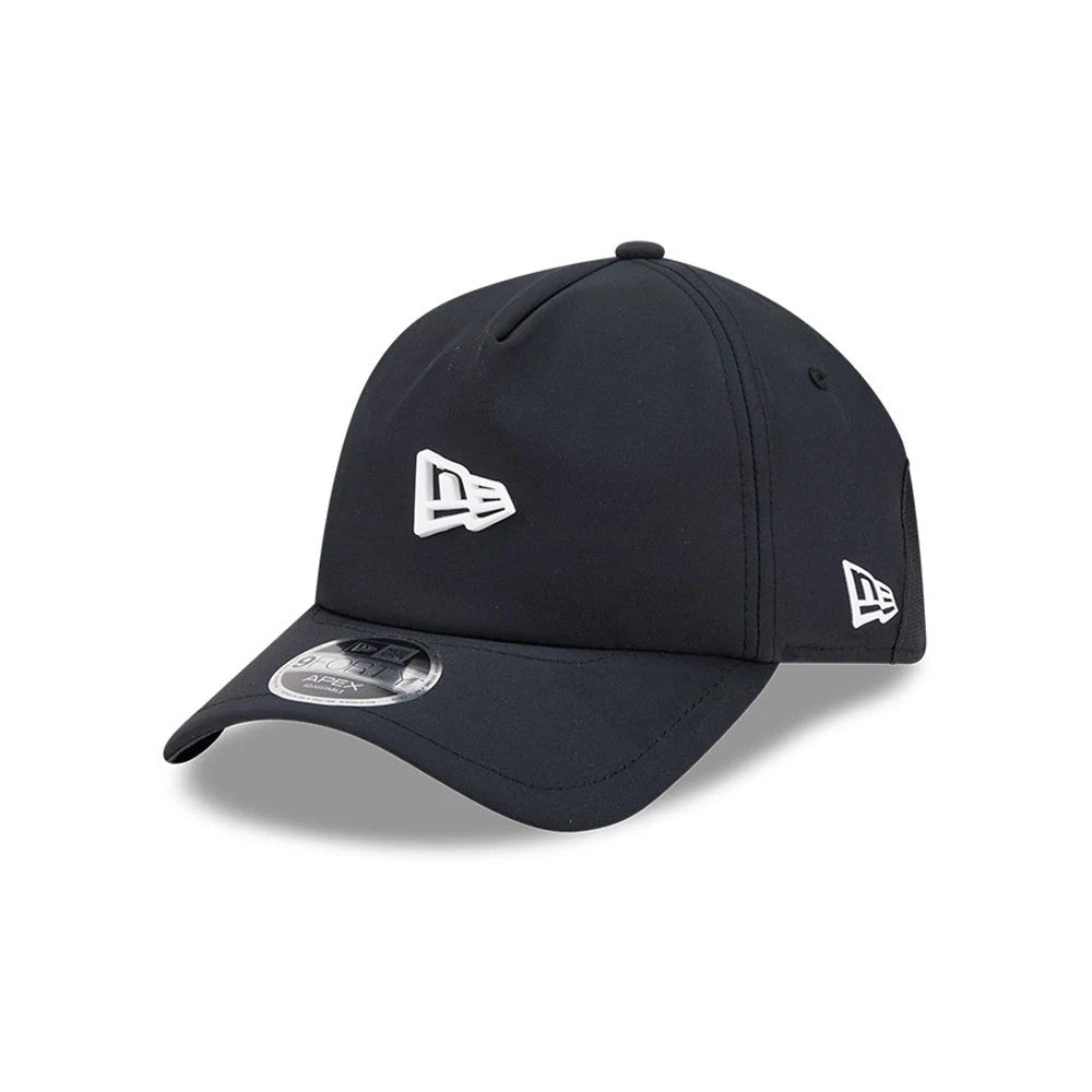 New Era Golf Black 9FORTY Apex Adjustable Cap, three-quarter view showing the white raised embroidered New Era flag logo on the front panel and left side, with a curved black visor featuring the 9FORTY size sticker on top.