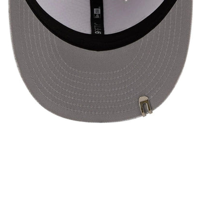 Pictured is this New Era Golf 9FIFTY Snapback cap in white. 2