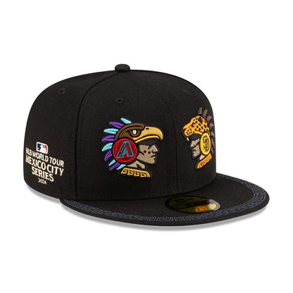 Dueling League MLB Mexico City Series 2026 Black New Era 59FIFTY Fitted Cap, three-quarter view showing the dual embroidered logos on the front panel depicting an eagle and jaguar warrior, with a black visor featuring intricate patterns.