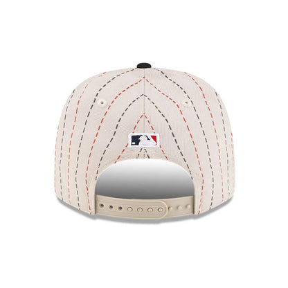 Pictured is this MLB Mexico City Series 2026 MLB Dueling League Logos 9SEVENTY Stretch Snap Adjustable cap in light beige. 7