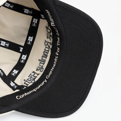 Pictured is this New Era X Hermanos Koumori Running Camper cap in light beige. 6