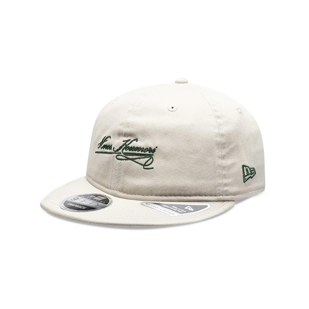Pictured is this New Era X Hermanos Koumori Cursive Retro Crown 9FIFTY cap in Cream. 1