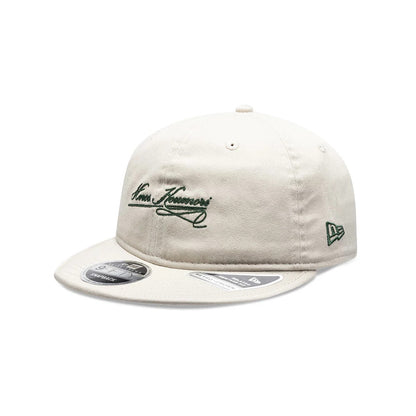 Pictured is this New Era X Hermanos Koumori Cursive Retro Crown 9FIFTY cap in Cream. 1