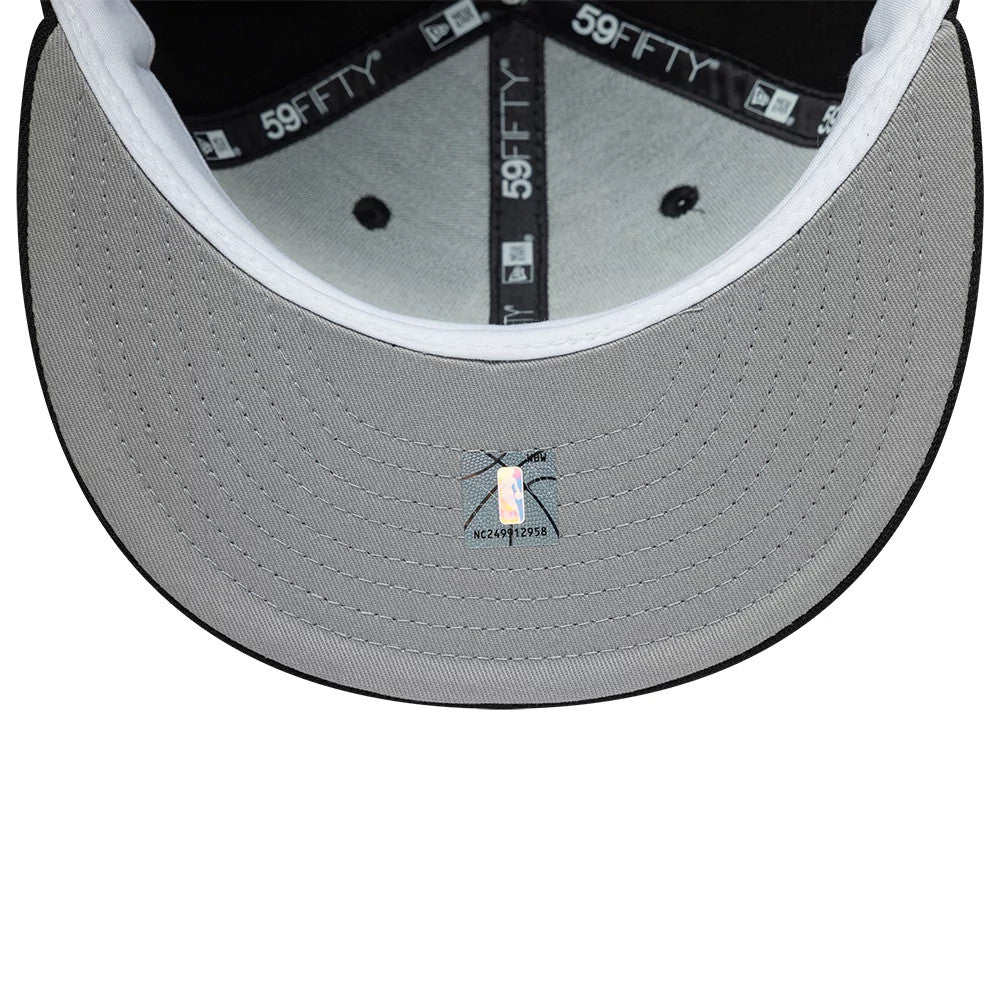Vancouver Grizzlies NBA Hardwood Classic Black New Era 59FIFTY Fitted Cap, inside view showing the grey undervisor with a holographic sticker, black branded 59FIFTY taping along the seams, and a white sweatband around the crown edge.