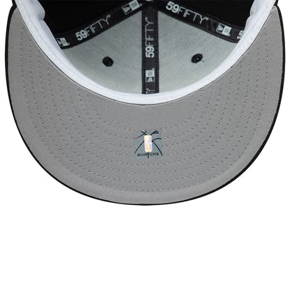 Vancouver Grizzlies NBA Hardwood Classic Black New Era 59FIFTY Fitted Cap, inside view showing the grey undervisor with a holographic sticker, black branded 59FIFTY taping along the seams, and a white sweatband around the crown edge.