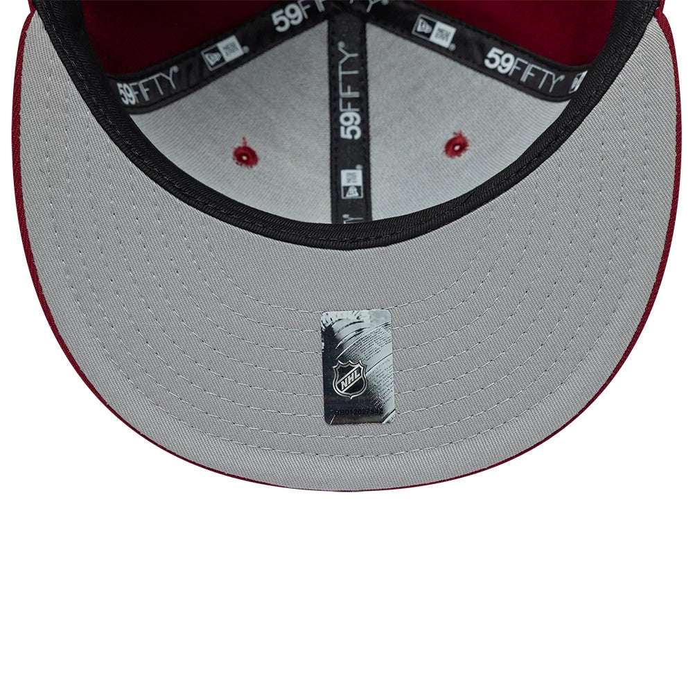 Colorado Avalanche NHL Basic Dark Red New Era 59FIFTY Fitted Cap, inside view showing grey undervisor with an NHL sticker, red eyelets on the panels, black sweatband, and 59FIFTY branded taping across the crown.