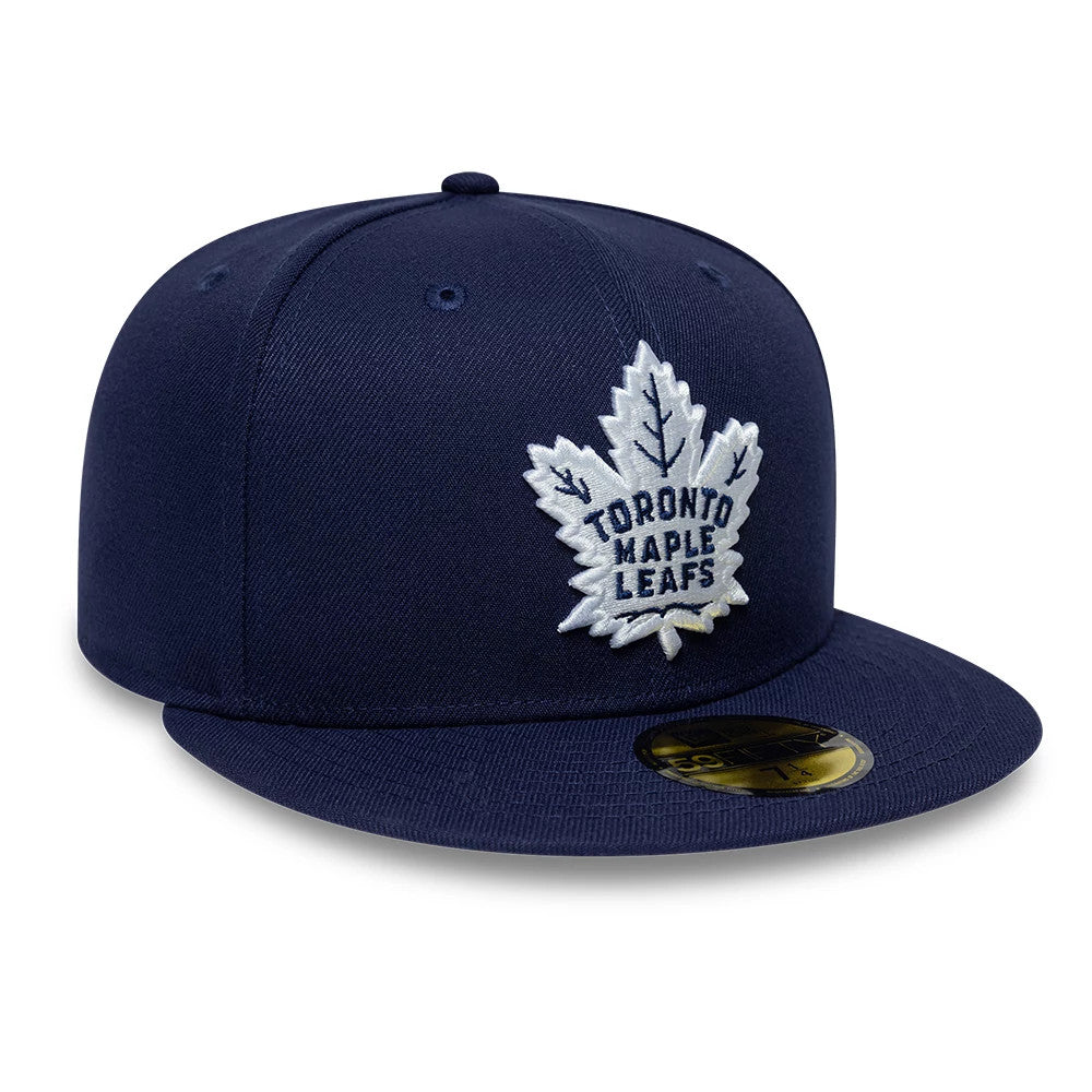 Pictured is this NHL Basic Toronto Maple Leafs 59FIFTY Fitted cap in navy. 4