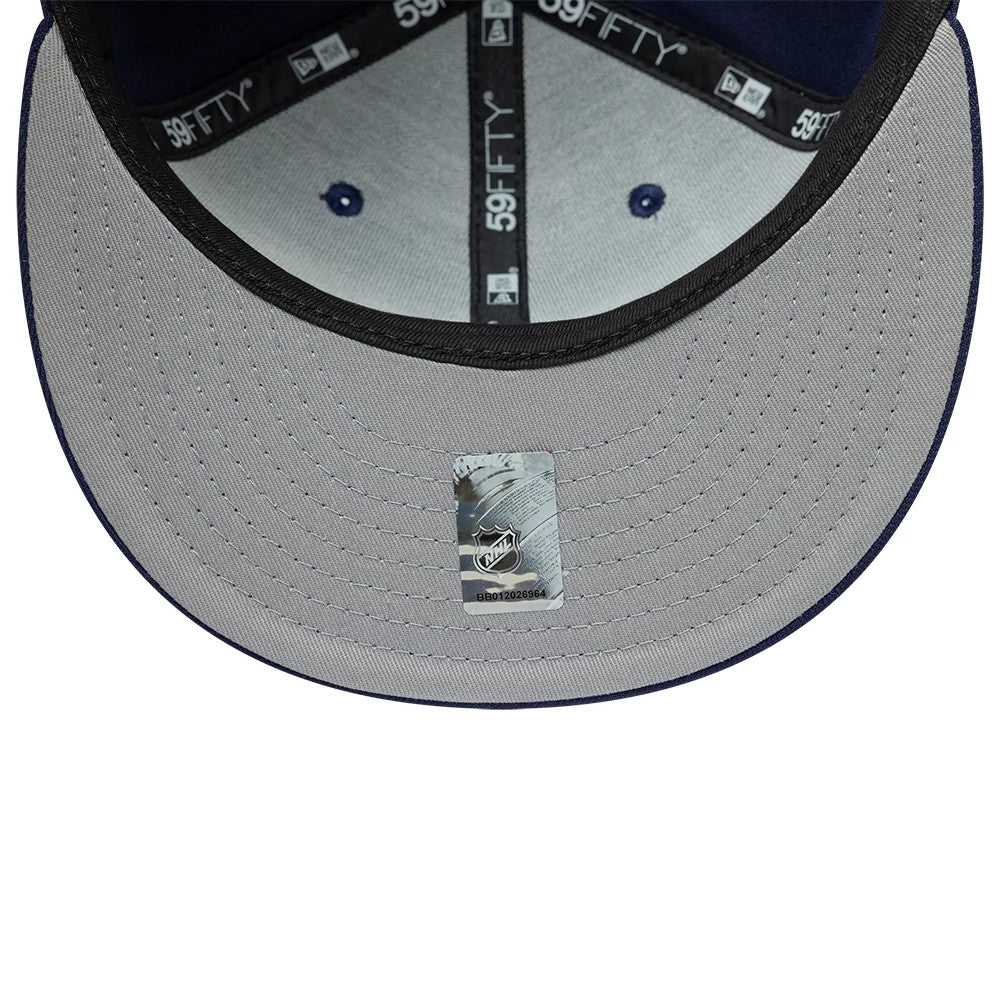 Pictured is this NHL Basic Toronto Maple Leafs 59FIFTY Fitted cap in navy. 2