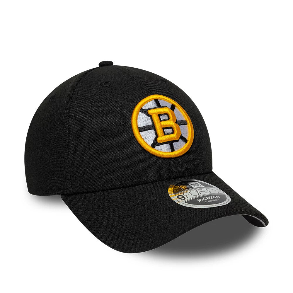Boston Bruins NHL Team Black New Era 9FORTY M-Crown Adjustable Cap, three-quarter view showing the raised yellow and white Boston Bruins logo embroidered on the front panel, with a curved black visor and 9FORTY size sticker on top.