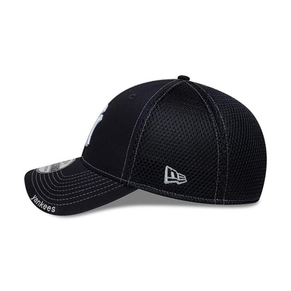 Yankees MLB Neo Navy New Era 39THIRTY Stretch Fit Cap, side view showing the grey embroidered New Era flag logo on the navy mesh back panel, with a pre-curved visor featuring white Yankees lettering and a 39THIRTY size sticker.