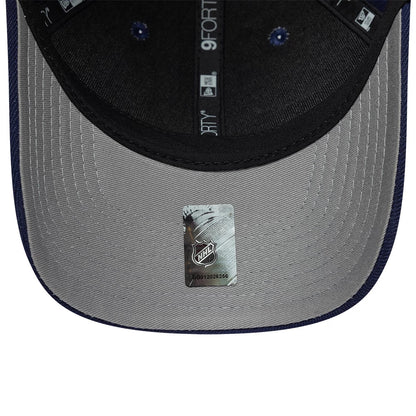 Toronto Maple Leafs NHL Team Navy New Era 9FORTY M-Crown Adjustable Cap, inside view showing the grey undervisor with an NHL logo sticker, black sweatband, and branded 9FORTY taping running across the inner crown.