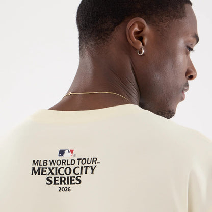 The model is wearing this MLB Mexico City Series 2026 Clash MLB Dueling Logo T-Shirt in Cream 7