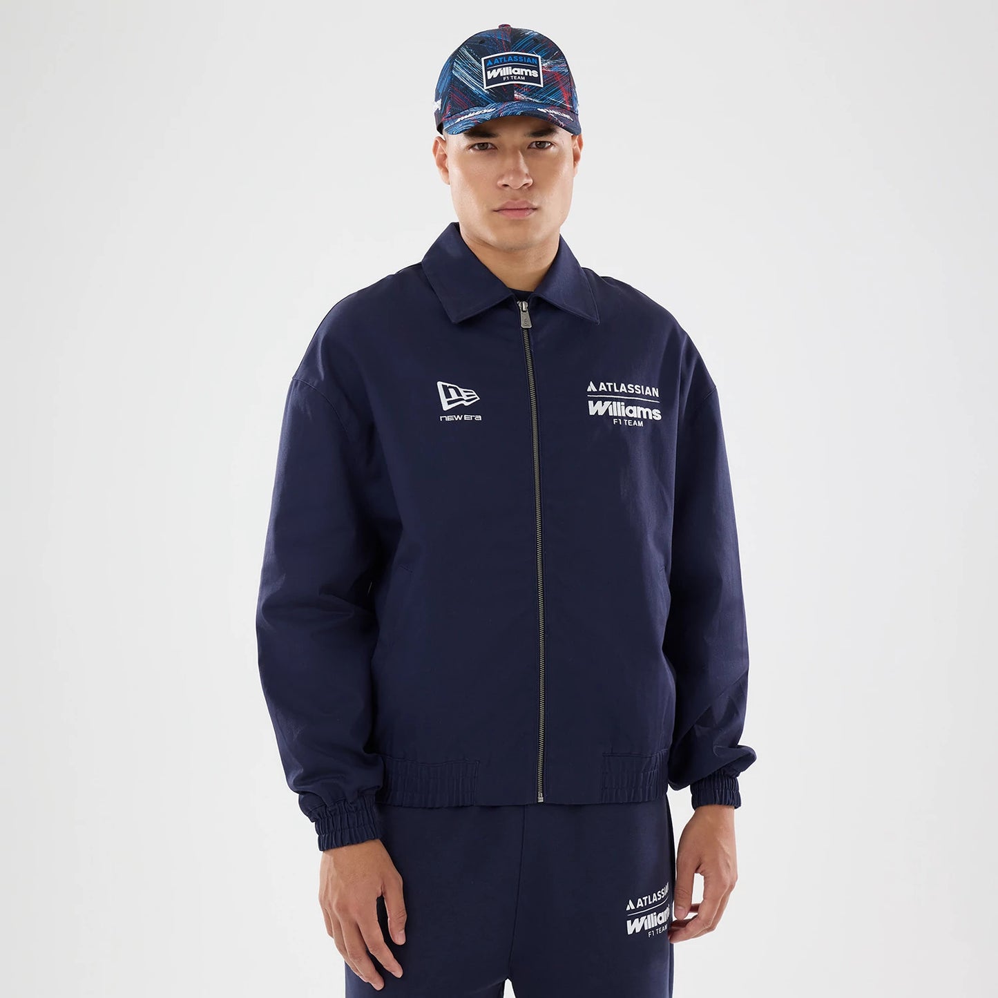 The model is wearing this Williams GB Race Special Collared Jacket in navy. 1