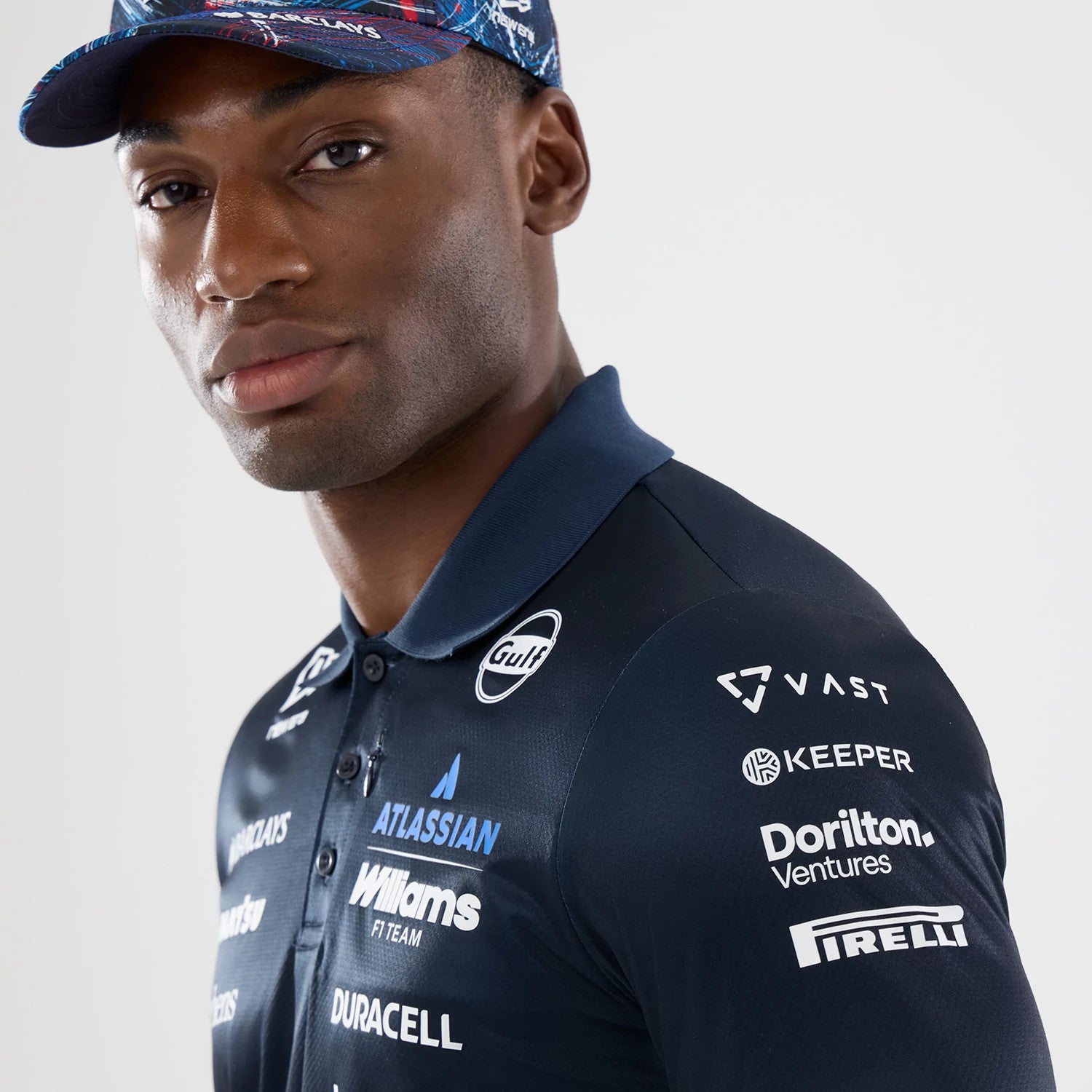 The model is wearing this Williams GB Race Special Tech Polo T-Shirt in navy. 4