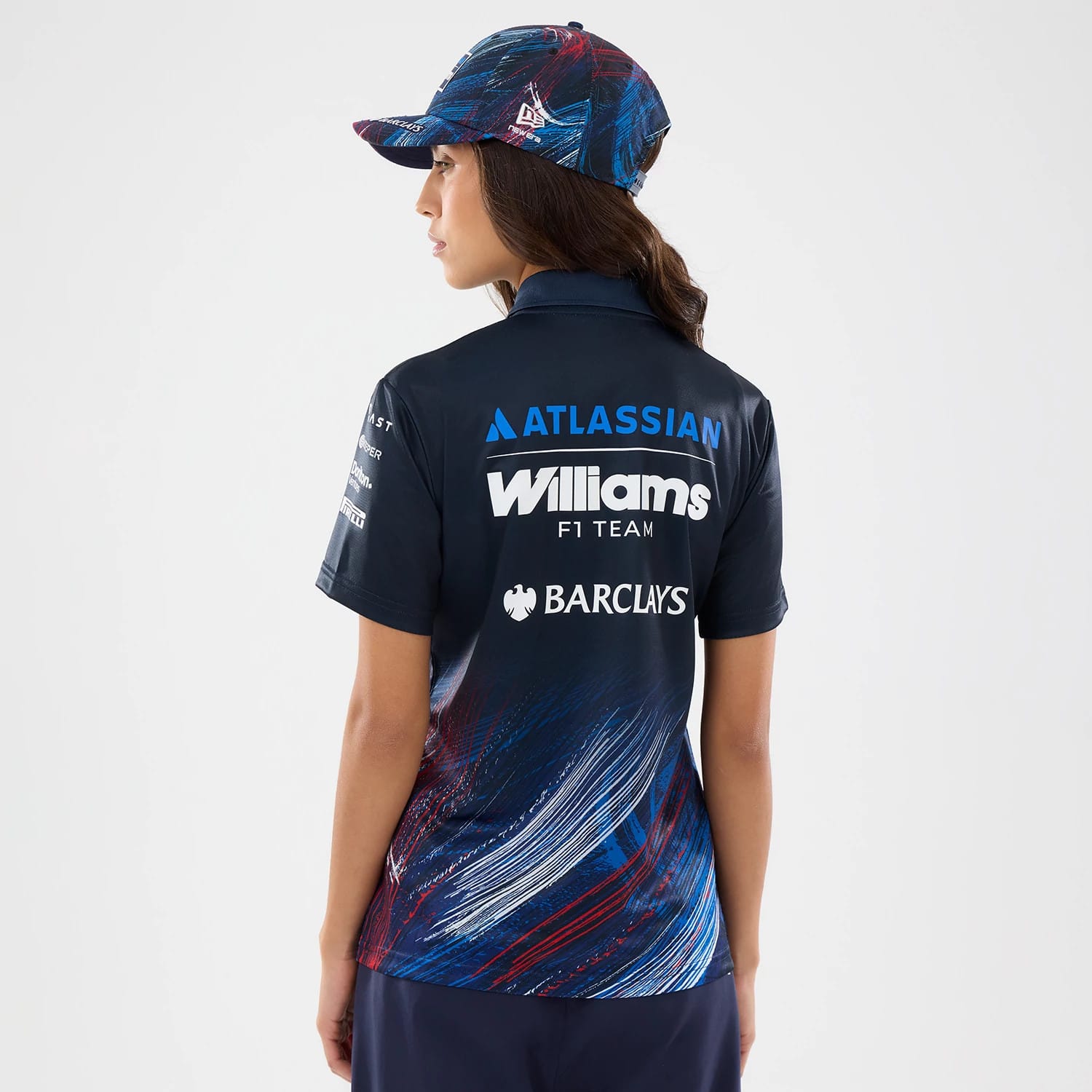 The model is wearing this Womens Williams GB Race Special Tech Polo T-Shirt  in navy. 2