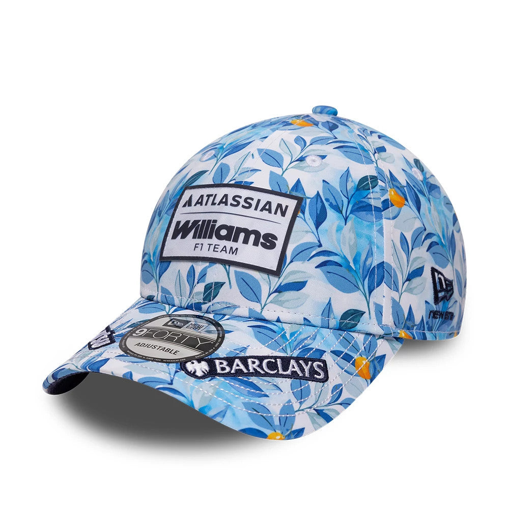 Williams Barcelona Race Special Multi New Era 9FORTY Adjustable Cap, front view showing a large embroidered Atlassian Williams F1 Team patch on a blue floral print, with a Barclays patch on the visor and a black 9FORTY size sticker.