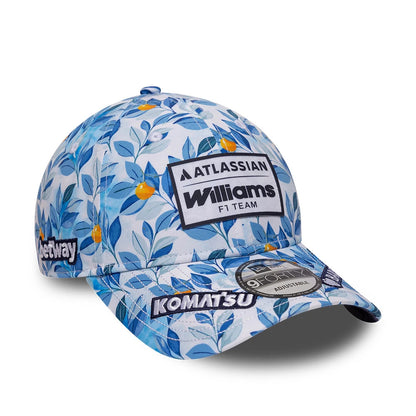 Williams Alex Albon Barcelona Race Special Multi New Era 9FORTY Adjustable Cap, front view showing the white embroidered Williams F1 Team logo patch on a blue and white floral print crown, with the 9FORTY size sticker on the visor.