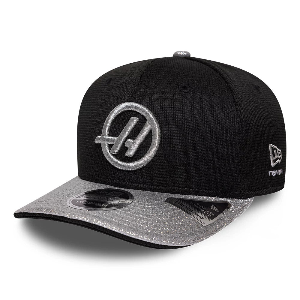 TGR Haas F1 Vegas Race Special Black New Era 9SEVENTY Stretch Snap Adjustable Cap, front view showing a silver embroidered logo on the black front panel, a sparkling silver visor with the 9SEVENTY size sticker.