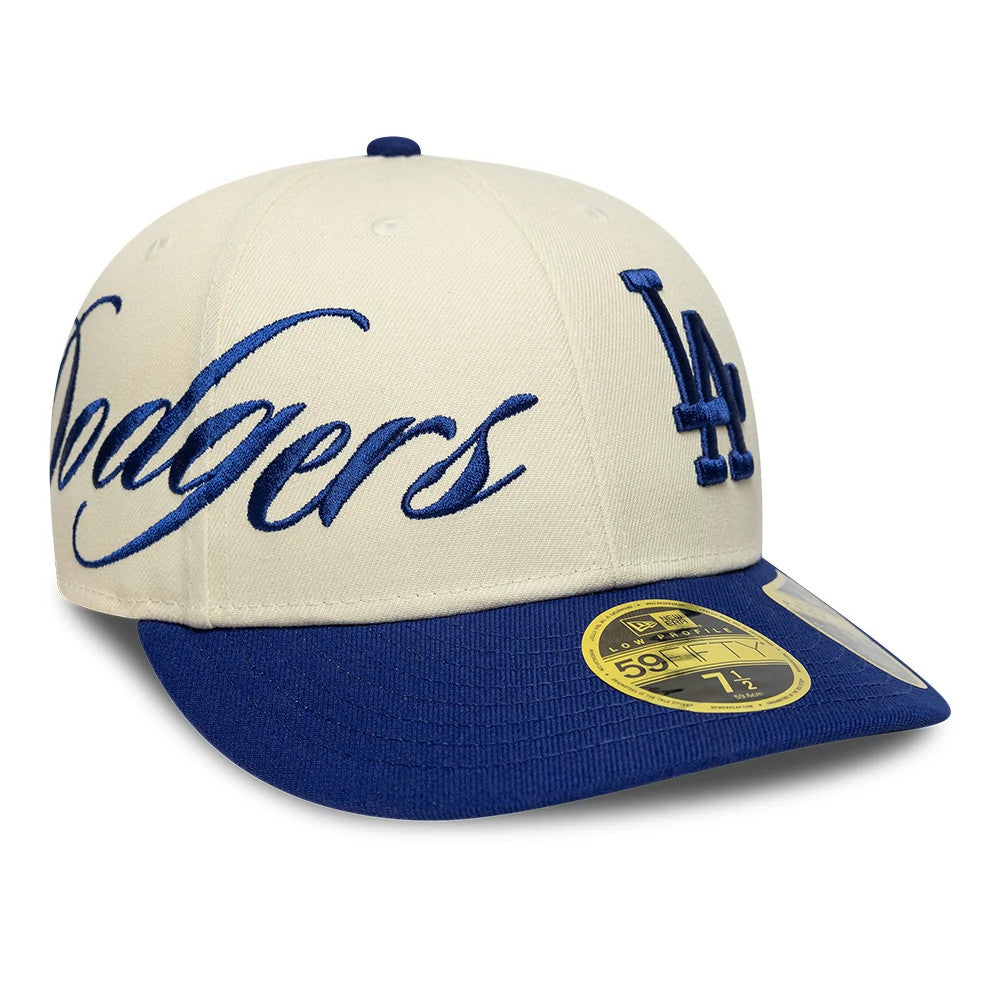LA Dodgers MLB Side Script Cream New Era Low Profile 59FIFTY Fitted Cap, three-quarter view showing large blue Dodgers script and LA logo on the front panels, with a contrasting blue visor and a gold 59FIFTY size sticker on the visor.