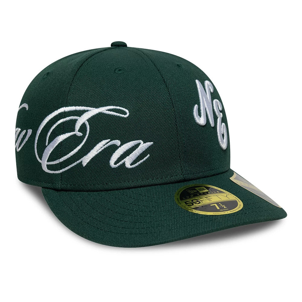 New Era Side Script Dark Green Low Profile 59FIFTY Fitted Cap, front view showing large white script embroidery across the dark green front panels, a gold 59FIFTY size sticker on the curved visor, and matching colour stitching on the crown.