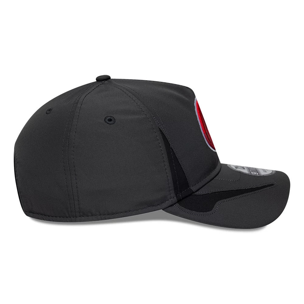 Vancouver Canadians MiLB Panel Charcoal New Era 9TWENTY A-Frame Adjustable Cap, side view showing the embroidered red team logo on the front panel, black eyelets on the structured charcoal crown, and the slightly curved visor with a size sticker.