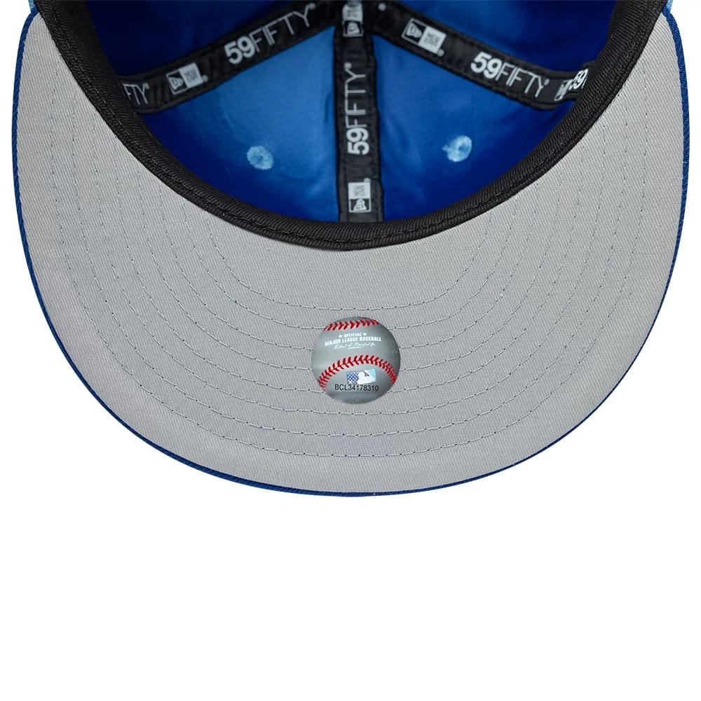 Pictured is this MLB Multi Logo Kansas City Royals 59FIFTY Fitted cap in pastel blue. 2