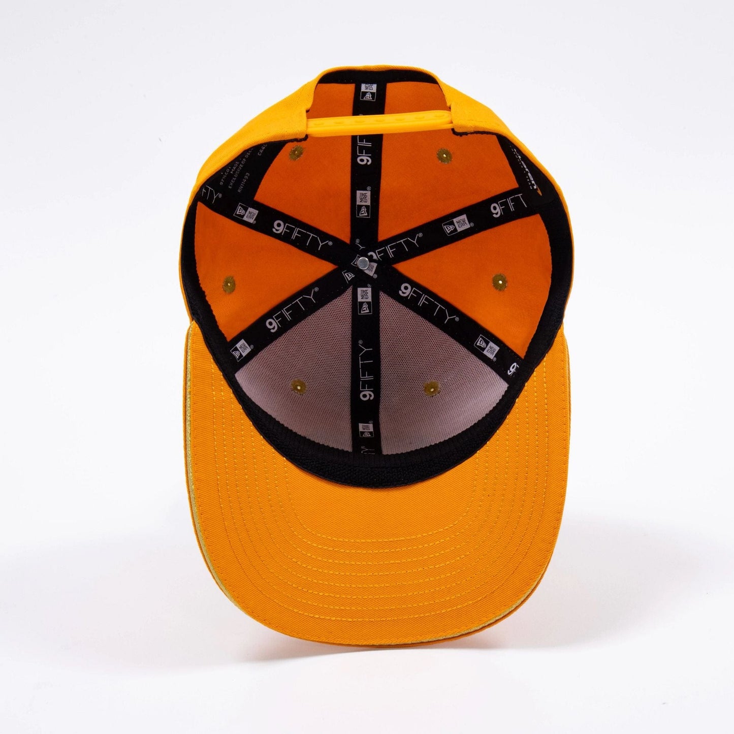 Pictured is this McLaren Formula 1 Team Lando Norris 2025 Drivers' World Champion 9FIFTY Stretch Snap Cap in orange. 4