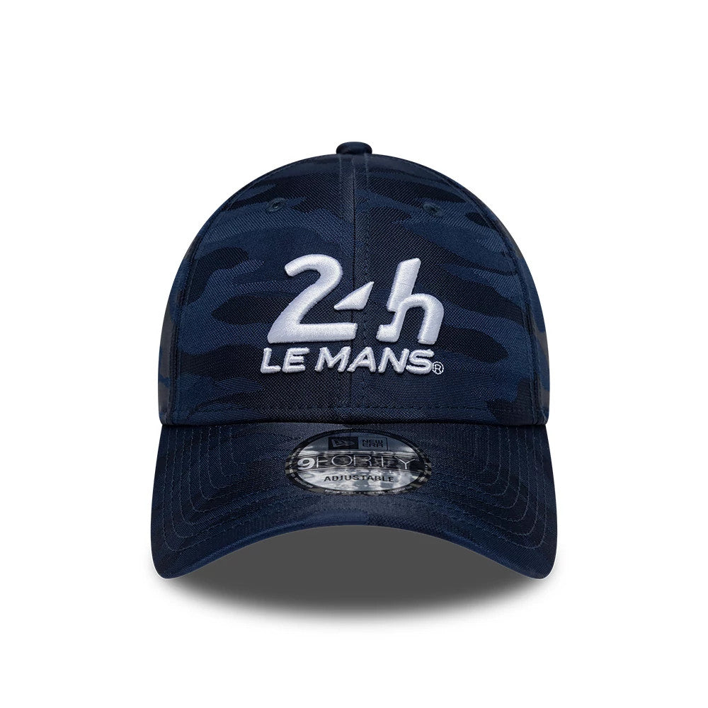 24HR Le Mans Camo Dark Blue New Era 9FORTY Adjustable Cap, front view showing raised white embroidered 24h Le Mans logo on a camo dark blue crown, with a curved visor and 9FORTY size sticker at the centre.