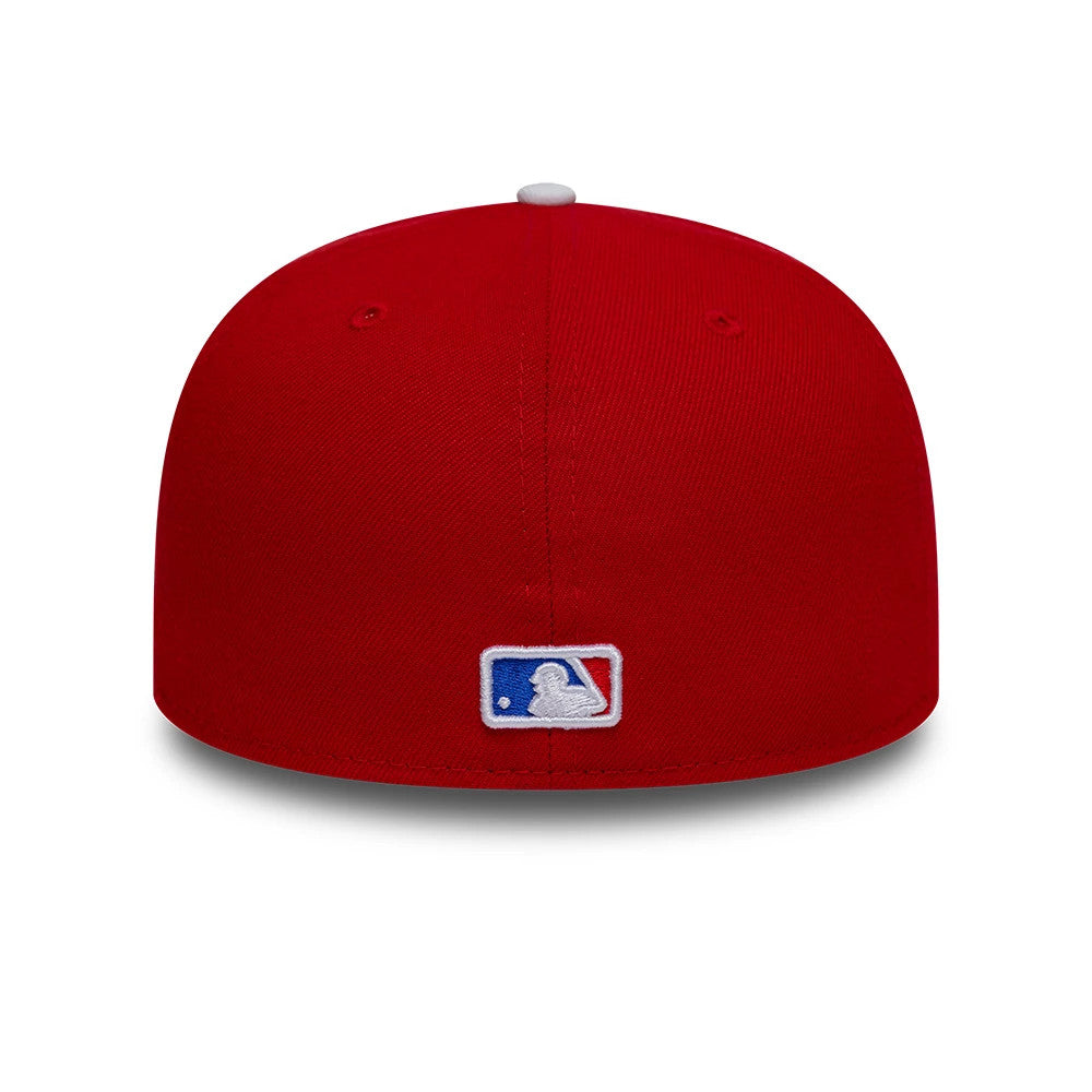 New York Mets MLB Sister Cities Red & Blue New Era 59FIFTY Fitted Cap, rear view showing the white embroidered MLB Batterman logo centred on the structured red crown, with matching red eyelets and a contrasting white top button.
