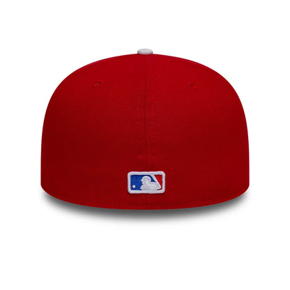 New York Mets MLB Sister Cities Red & Blue New Era 59FIFTY Fitted Cap, rear view showing the white embroidered MLB Batterman logo centred on the structured red crown, with matching red eyelets and a contrasting white top button.