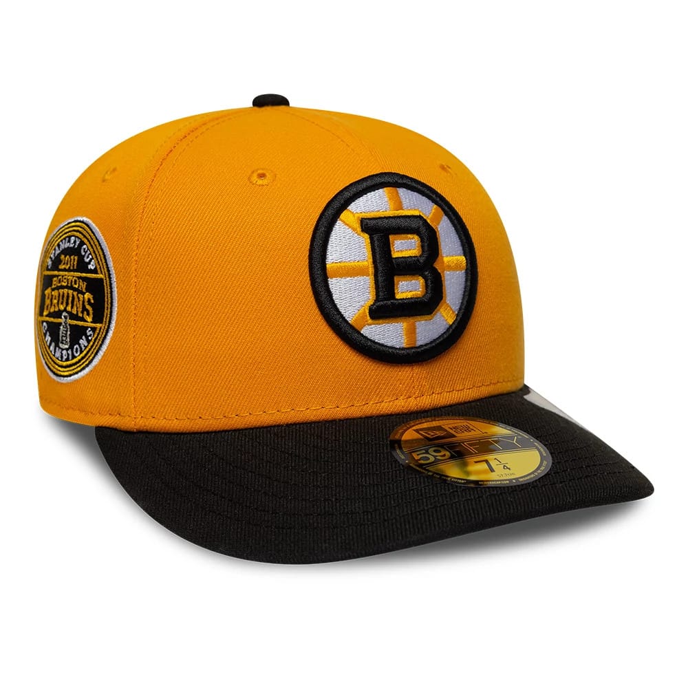 Pictured is this NHL Champions Boston Bruins 59FIFTY Fitted cap in orange & black. 1