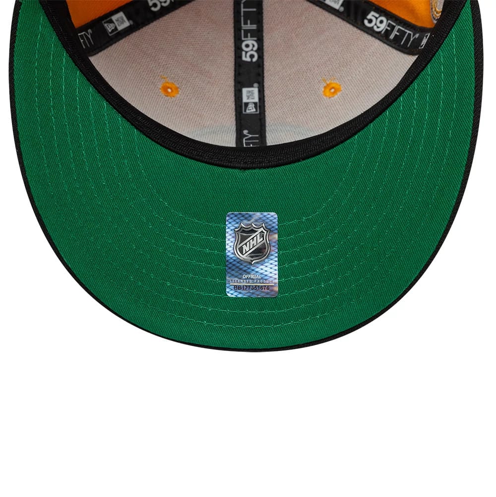 Pictured is this NHL Champions Boston Bruins 59FIFTY Fitted cap in orange & black. 2