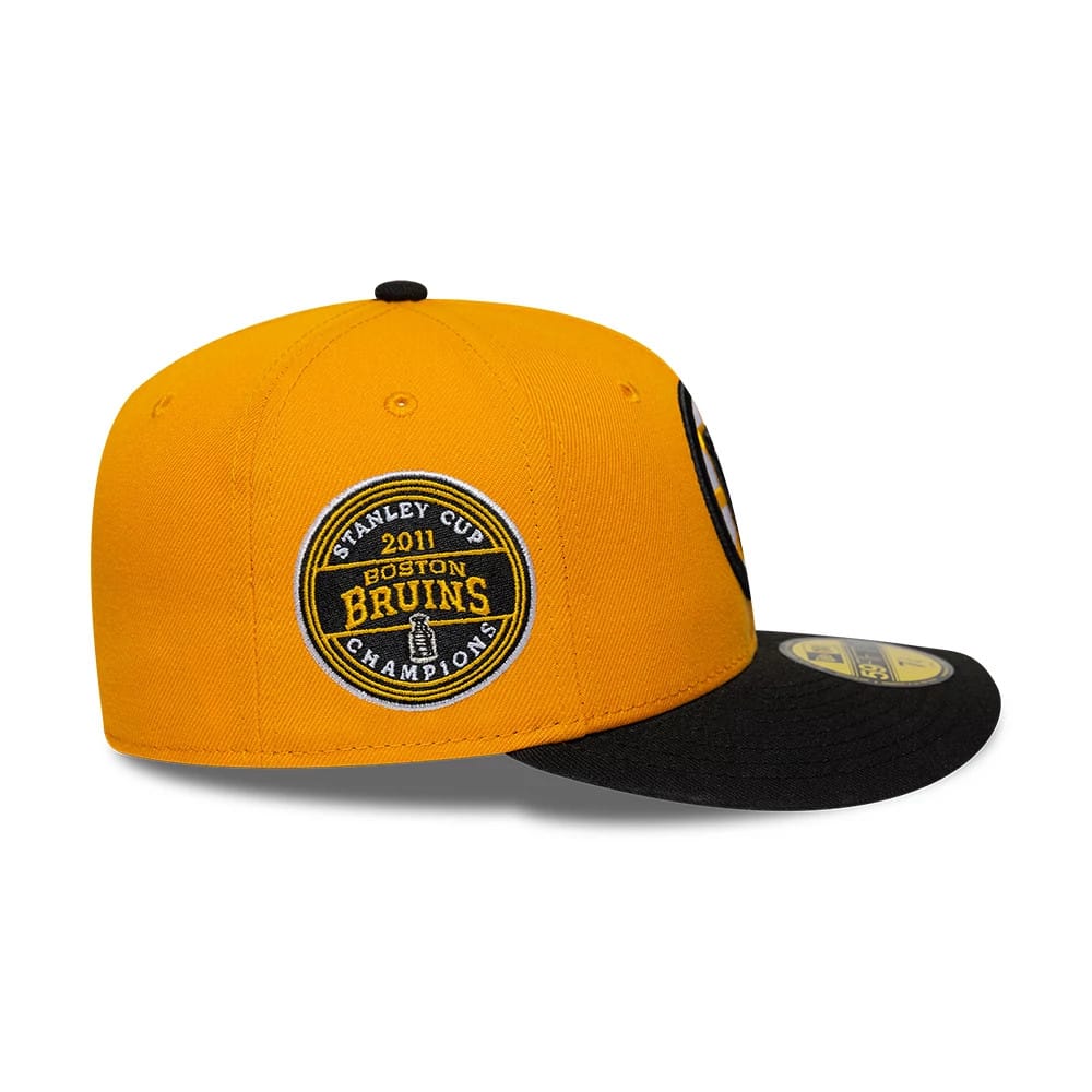 Pictured is this NHL Champions Boston Bruins 59FIFTY Fitted cap in orange & black. 6