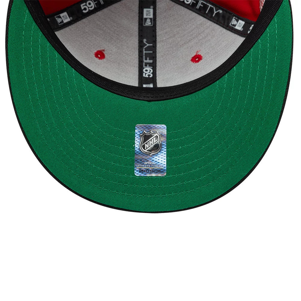 Pictured is this NHL Champions Chicago Blackhawks 59FIFTY Fitted cap in red & black. 2