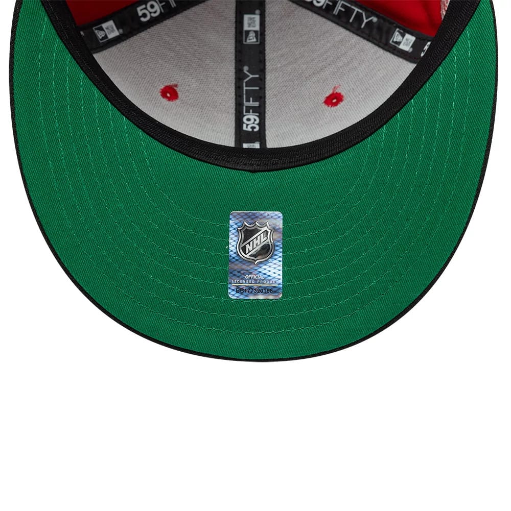Pictured is this NHL Champions Chicago Blackhawks 59FIFTY Fitted cap in red & black. 2