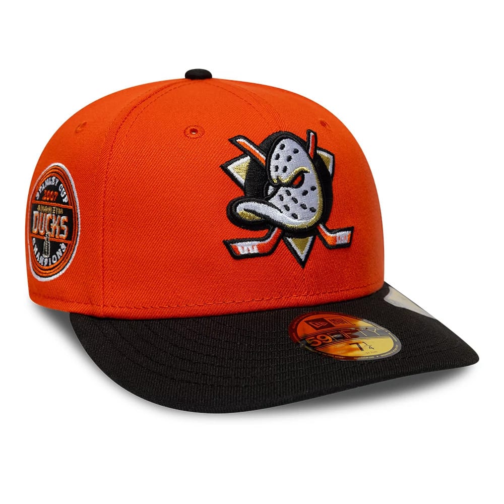 Pictured is this NHL Champions Anaheim Ducks 59FIFTY Fitted cap in orange & black. 1