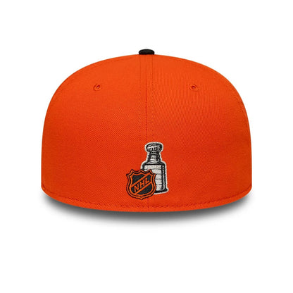 Pictured is this NHL Champions Anaheim Ducks 59FIFTY Fitted cap in orange & black. 5