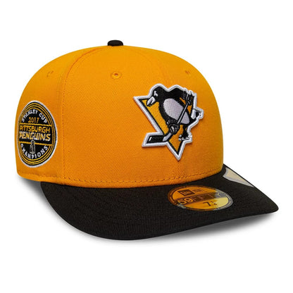 Pictured is this NHL Champions Pittsburgh Penguins 59FIFTY Fitted cap in yellow & black. 1