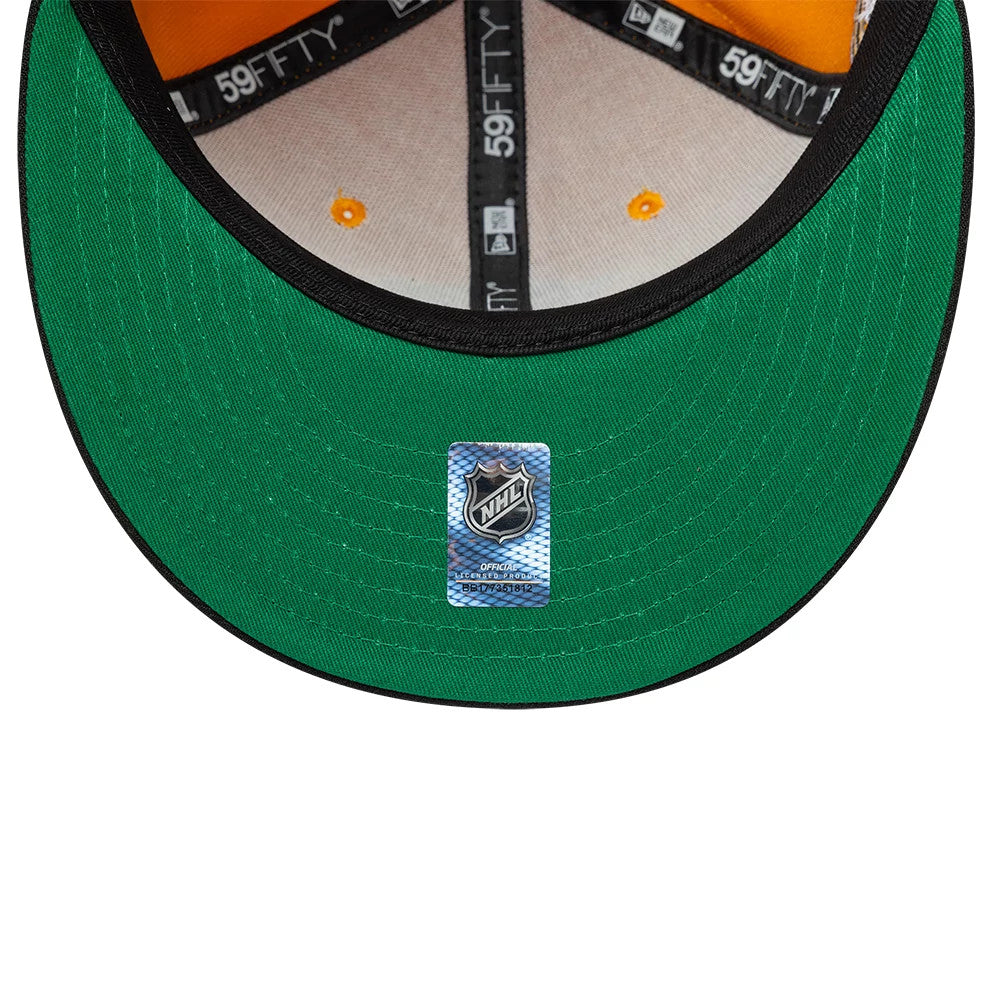 Pittsburgh Penguins NHL Champions Yellow & Black New Era 59FIFTY Fitted Cap, inside view showing the orange sweatband, black 59FIFTY taping, and a green undervisor with the NHL sticker centrally placed.
