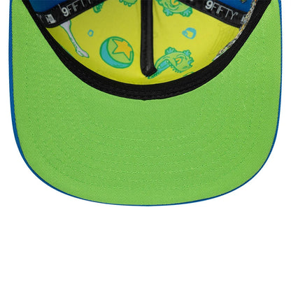 Rugrats Party In The Playpen Blue New Era 9FIFTY A-Frame Snapback Adjustable Cap, inside view showing a yellow lining with Rugrats characters and elements, a green undervisor, and black taping with white 9FIFTY branding.