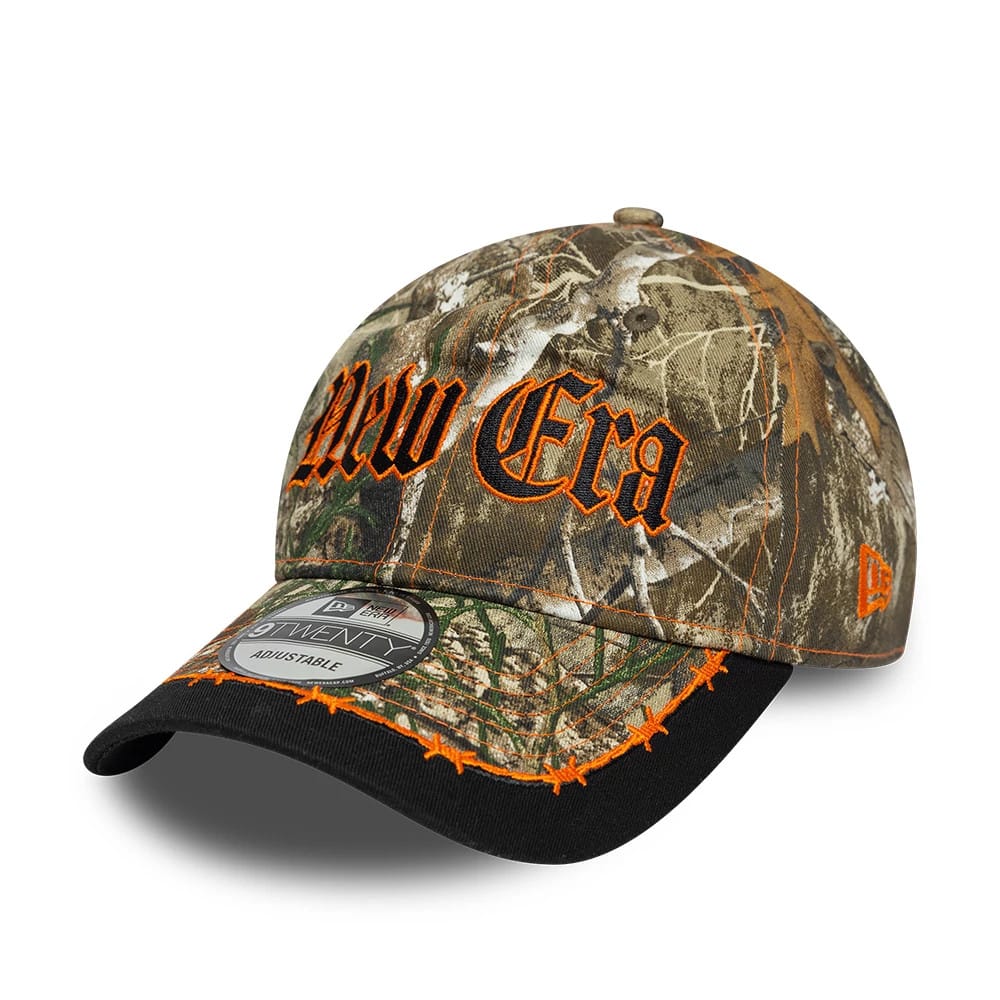 Pictured is this New Era Real Tree 9TWENTY cap in assorted print. 1