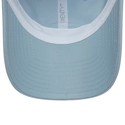 Lacoste X New Era Pastel Blue New Era 9TWENTY Adjustable Cap, inside view showing the light blue undervisor with stitching, white sweatband, and branded taping along the interior for added style and comfort.