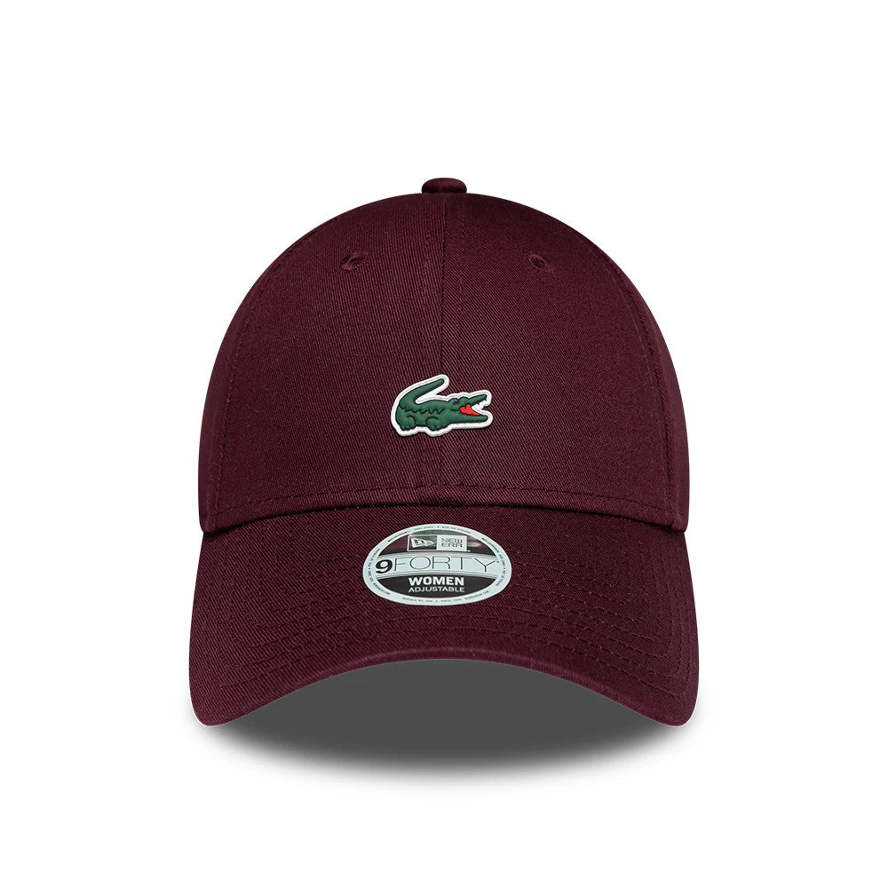 Womens Lacoste X New Era Dark Purple 9FORTY Adjustable Cap, front view showing the raised green Lacoste crocodile logo on the dark purple structured crown, with a curved visor and a 9FORTY size sticker on the centre.